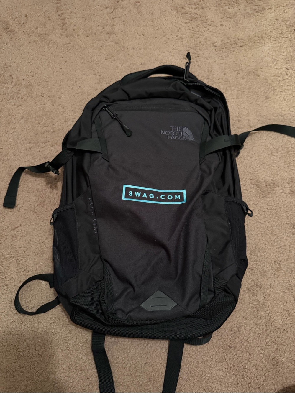 The North Face Black Fall Backpack with SWAG.COM logo